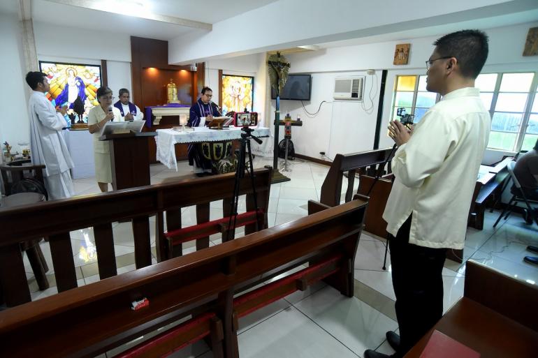 Priests in Manila celebrate Mass
