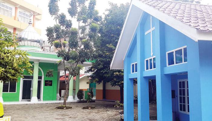 A private school with four houses of worship on its campus promotes diversity and tolerance among students in Indonesia.