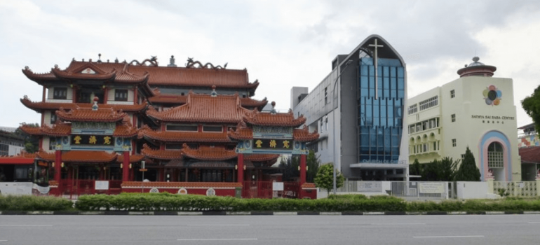 A Chinese Buddhist temple, a Christian church and a Sathya Sai Baba Centre stand side by side along Moulmein Road in Singapore, the world’s most religiously diverse nation, according to a 2014 analysis by the Pew Research Center.