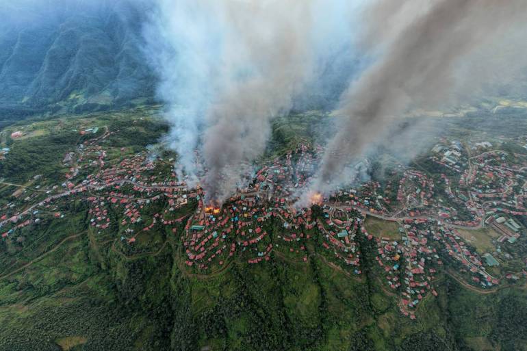 aerial shot thantlang building destroyed by shelling from junta