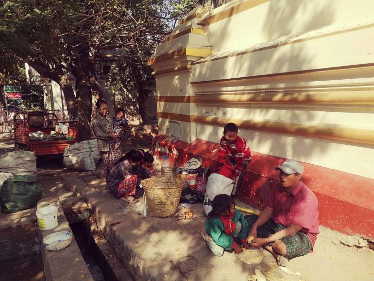 Homeless with a heart even near a garbage dump Nay Aung and Khin Mar Oo’s family collects garbage for daily living on the 24th street in Mandalay, Myanmar. Nay Aung is raising five children, instilling a sense of hard work and honesty in them.