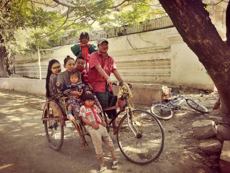 Nay Aung and Khin Mar Oo’s family collects garbage for daily living on the 24th street in Mandalay, Myanmar. Nay Aung is raising five children, instilling a sense of hard work and honesty in them. 