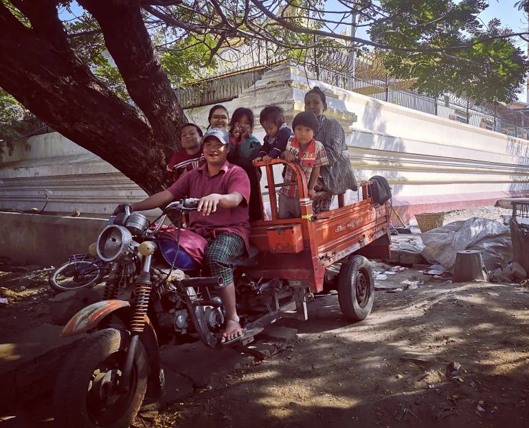 Nay Aung and Khin Mar Oo’s family collects garbage for daily living on the 24th street in Mandalay, Myanmar. Nay Aung is raising five children, instilling a sense of hard work and honesty in them. 