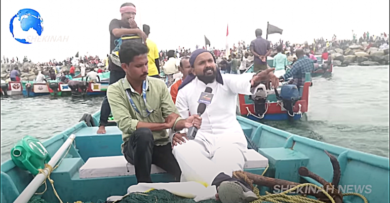 Priest speaking at Fishermen Protest at sea