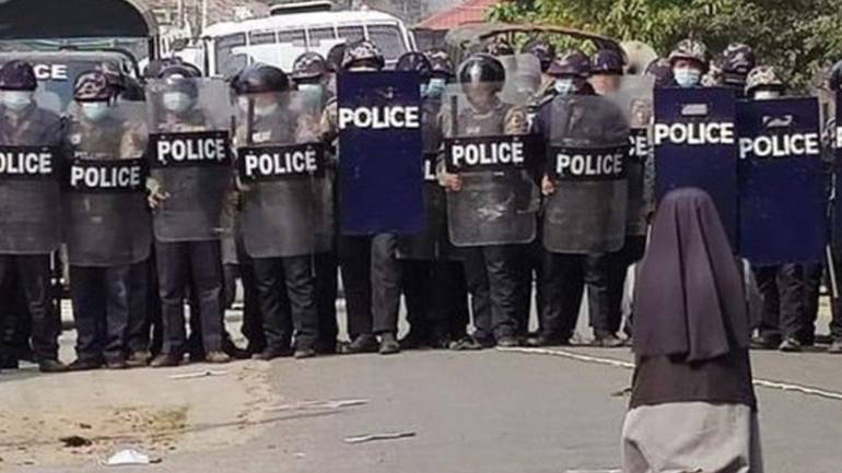 Sr. Ann Rose Twang kneels before riot police in March 2021 Sr. Ann Rose Twang kneels before riot police in March 2021