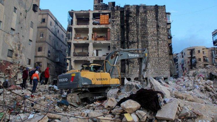 People gather to search for survivors in Aleppo