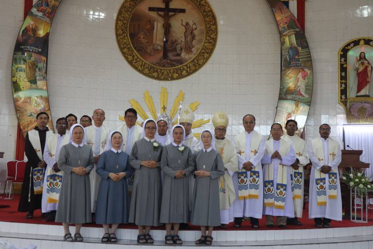 The two newly professed Sisters with Bishops Priests and others