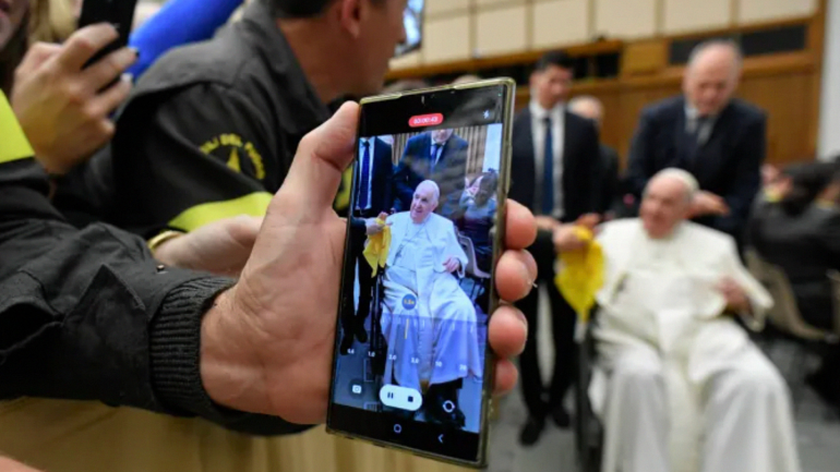 A person captures Pope Francis on their phone during a papal audience, Dec. 10, 2022. – VATICAN MEDIA