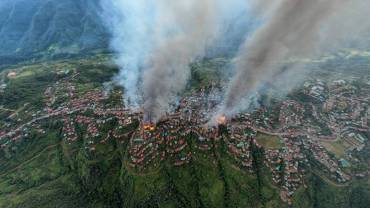 aerial shot thantlang building destroyed by shelling from junta