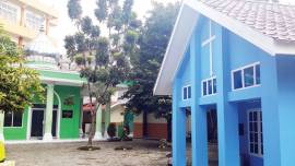 A private school with four houses of worship on its campus promotes diversity and tolerance among students in Indonesia.