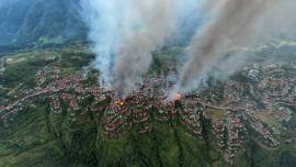 aerial shot thantlang building destroyed by shelling from junta