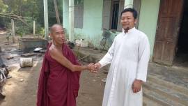 An elderly Buddhist monk stops at a Peinnegone Church rectory to sip tea and chew betelnut leaf in the Ayeyarwady region of Myanmar.